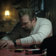 You can see the hair tie on Hopper’s right wrist as he creates the traps for the house.